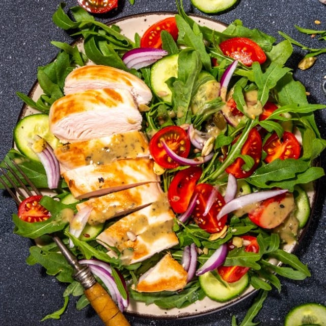 Grilled Chicken Over Mixed Green Salad.